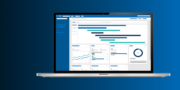 A laptop displaying a dashboard with charts, graphs, and timelines on a blue gradient background.