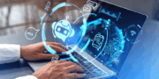 Hands typing on a laptop keyboard with digital graphics of a chatbot, smartphone, and globe overlayed, representing artificial intelligence, resources, and global connectivity.