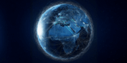 A digital rendering of Earth at night showing interconnected lines representing the global flow of resources and communication or data networks across continents.