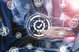 Person typing on a laptop with digital icons and network lines overlaid, representing business process automation and quality assurance.