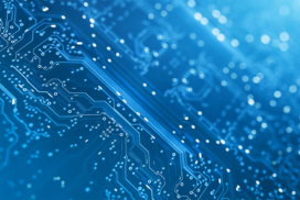 Close-up view of a blue electronic circuit board with intricate lines and components, representing technology and digital connections.