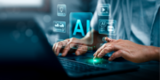 Person typing on laptop with AI-themed holographic icons, including text, video, image, and automation symbols, floating above the keyboard.